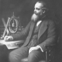 portrait-of-james-clerk-maxwell-depicting-him-with-the-spinning-coil-apparatus-he-and.png